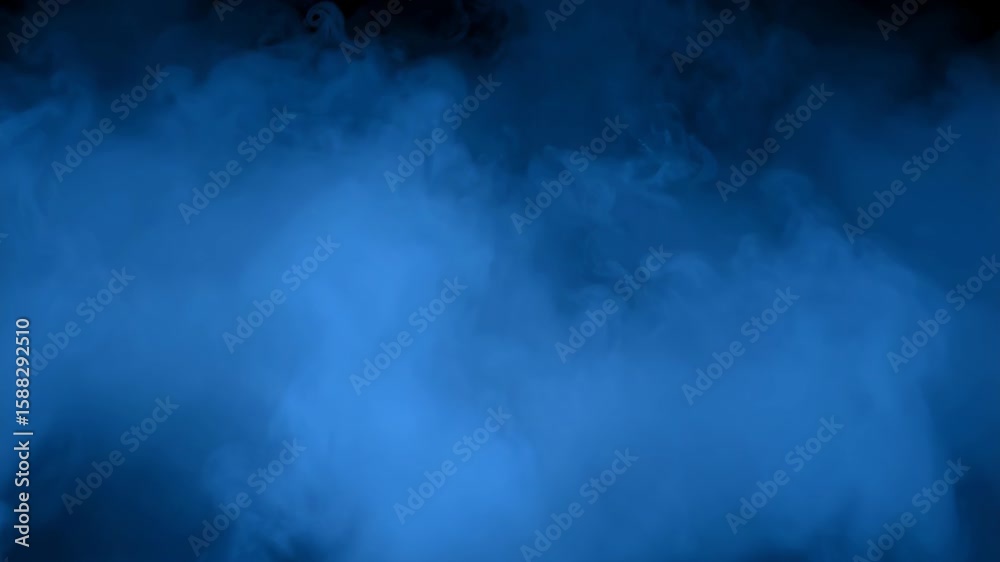 Dynamic dark blue fog rolling with a mysterious ambiance and soft billows on a black background, creating a spooky abstract visual.