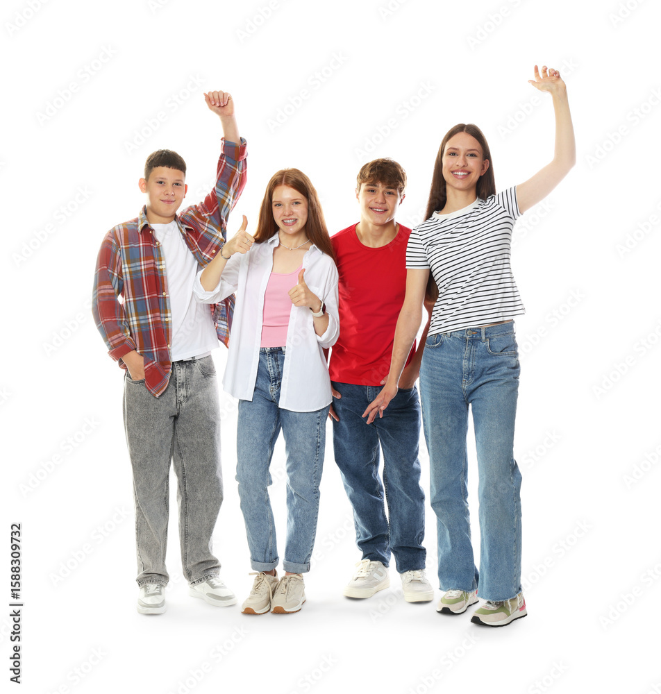 Obraz premium Excited teenagers posing together on white background