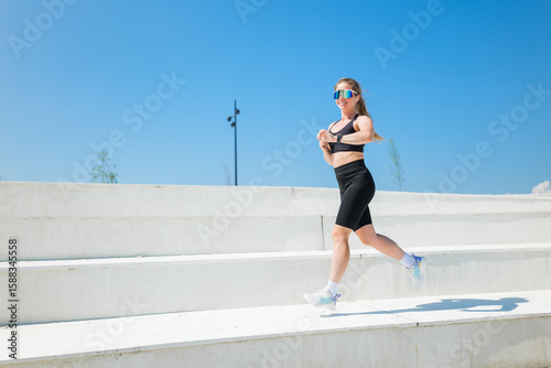 Sculpting a fit physique under the brilliant sun in a city park