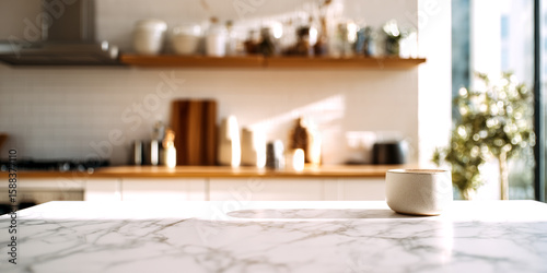 Bright modern kitchen with marble countertop and a cup of coffee