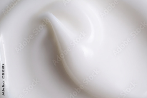 Close-Up of Smooth White Cream Texture in Soft Lighting