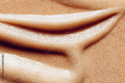 Close-Up of Creamy Coffee Foam with Smooth Swirling Texture