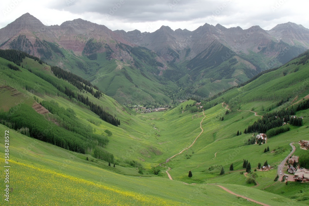 Naklejka premium Lush valley nestled amongst towering, rocky mountains