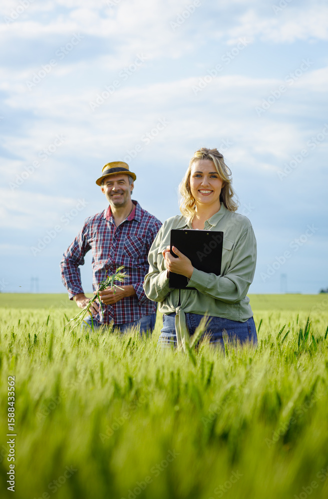 Potrait of farmer standing in wheat field looking at camera. Potrait of farmer standing in wheat field looking at camera.