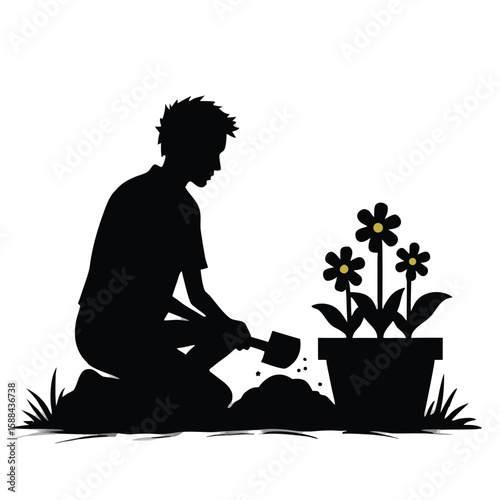 Person planting flowers in a pot silhouette kneeling