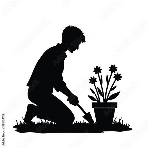 Person kneeling planting flowers in pot silhouette gardening