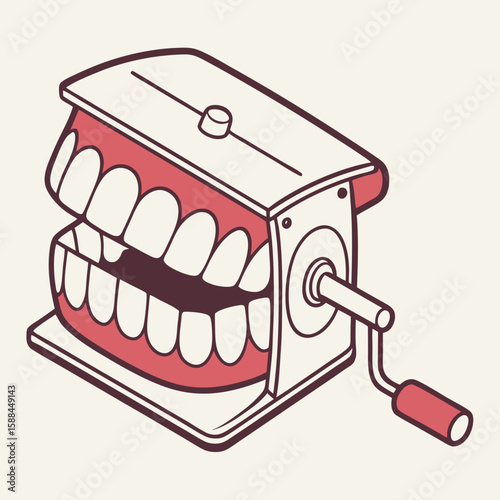 Retro wind-up toy with grinning cartoon teeth design  