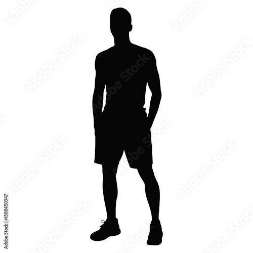 Athletic man standing with hands in pockets silhouette