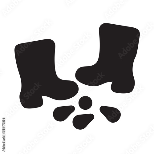 Rain boots beside muddy footsteps on the ground
