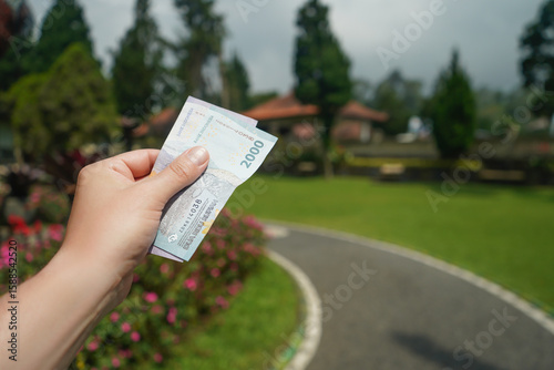 Indonesian rupiah. Balinese rupiah in hand