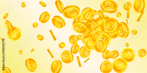 Thai baht coins falling. Gold scattered THB