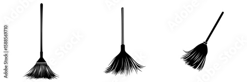 Various styles of black brooms used for sweeping and cleaning in different settings
