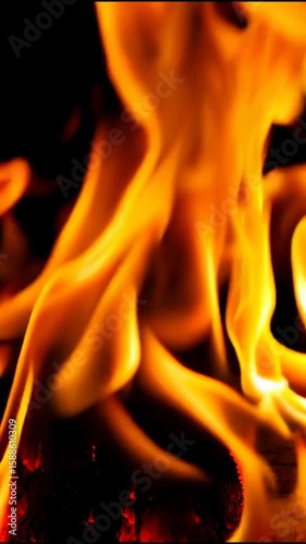 Fiery Flames: Intense and Dynamic Close-Up of Burning Fire with Bright Orange and Yellow Tongues