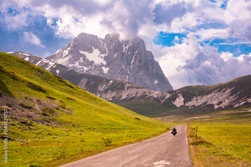 Mountain road in summer, sunny landscape