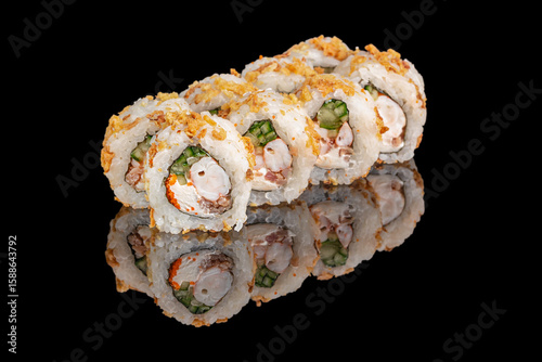Valokuva Sushi rolls filled with shrimp, cream cheese, cucumber, and crunchy toppings are