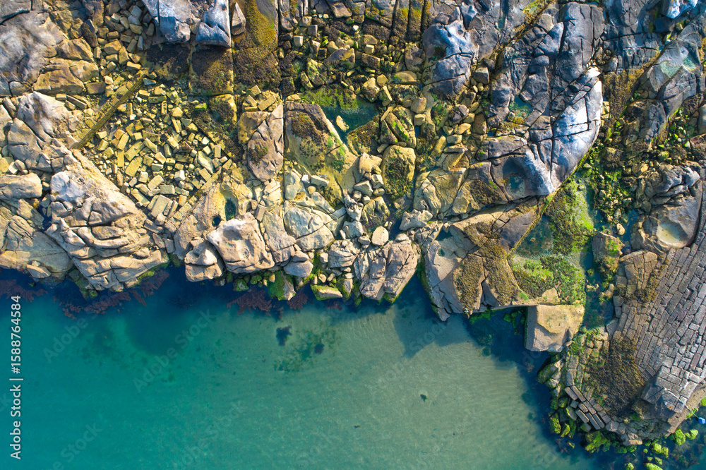 Obraz premium Wild Nature Landscape of a Cliff and the Ocean from Above, aerial drone top down view zenithal