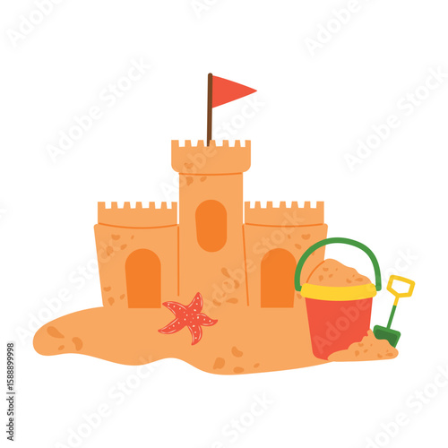 Sand castle with turret and flag on sand with starfish and childrens bucket