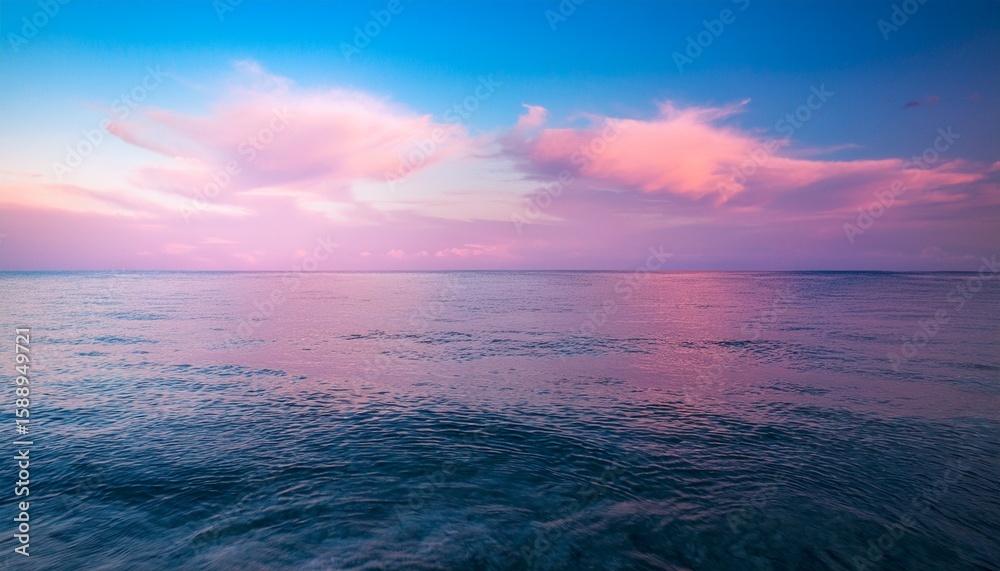 Fototapeta premium the ocean is calm and the sky is a pink color