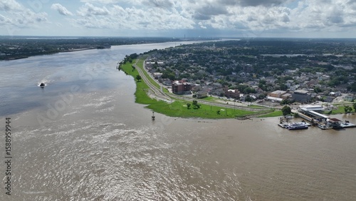 New Orleans, Louisiana urban neighborhood on the banks of the Mississippi River with Levees earthen embankments to control flooding from the river is also walking biking trail