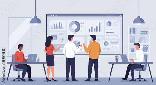 Office presentation with people gathered around a large screen displaying data