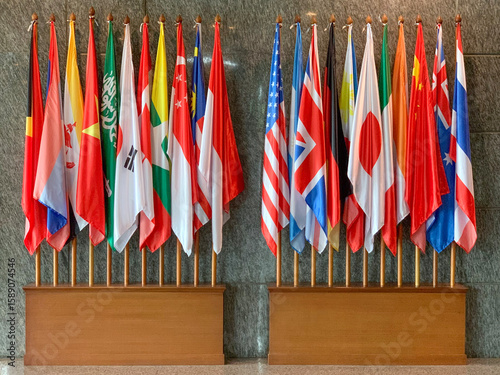 Bild auf Leinwand Multiple national flags representing international cooperation and diplomacy displayed indoors