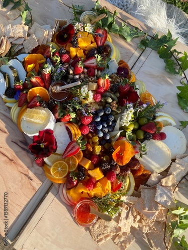 Sun-Drenched Summer Grazing Board with Cheese, Fruit, and Edible Flowers