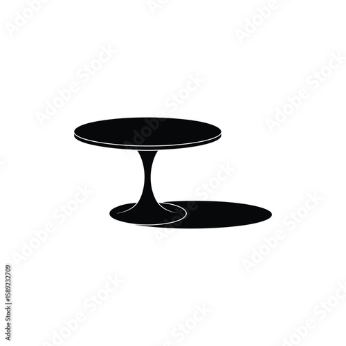 Minimalist black tulip table with a distinct shadow on a white background