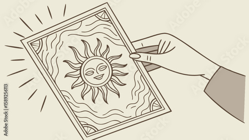 Hand holding tarot card with sun design and radiating lines on a light background color scheme