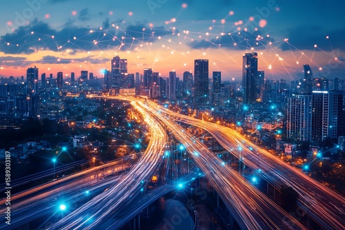 Cityscape at dusk with illuminated highways and digital network connection concept