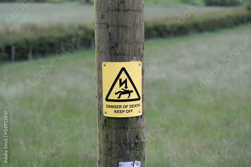Danger of death warning sign on a wooden post