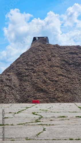Loader Dumping Mulch on Industrial Wood Chip Pile