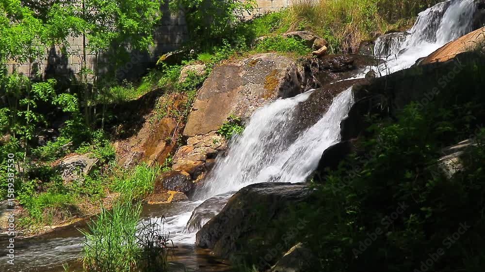 A 20-second still video of the Alzeau River waterfall in Saint Denis, Aude. A waterfall set amidst rocks in the south of France.
