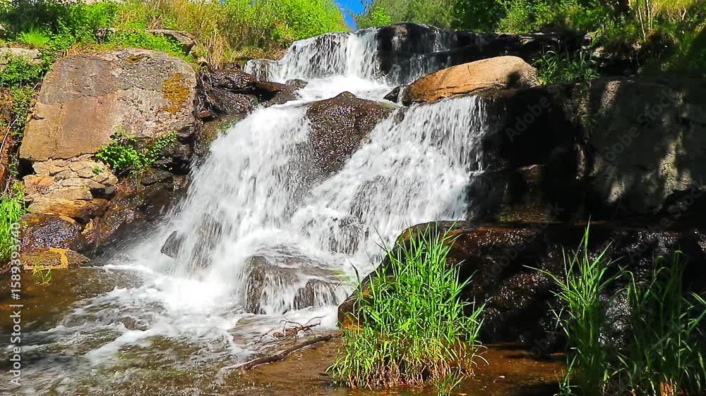 A 20-second still video of the Alzeau River waterfall in Saint Denis, Aude. A waterfall set amidst rocks in the south of France.
