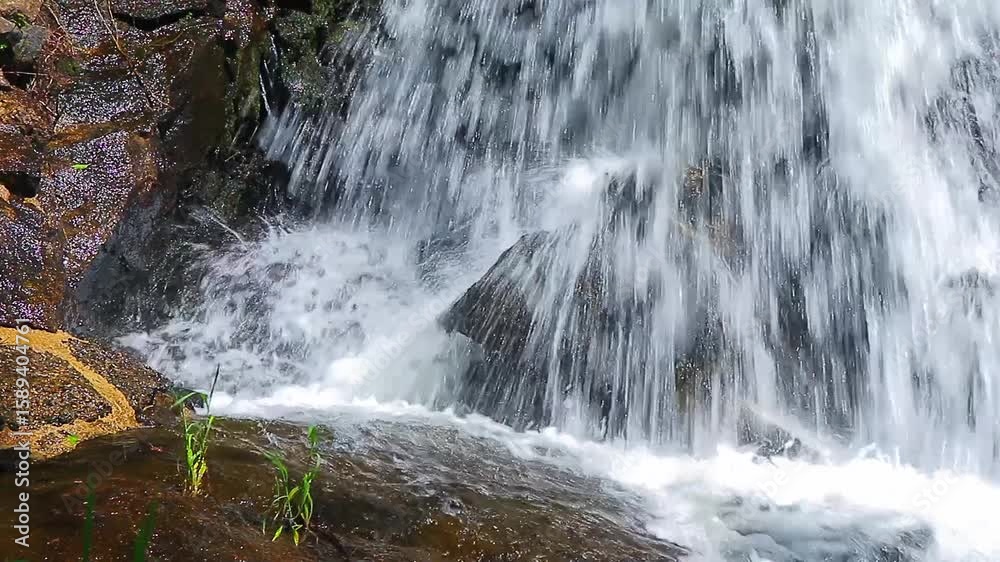 A 20-second still video of the Alzeau River waterfall in Saint Denis, Aude. A waterfall set amidst rocks in the south of France.
