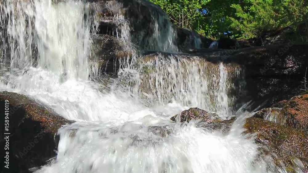 A 20-second still video of the Alzeau River waterfall in Saint Denis, Aude. A waterfall set amidst rocks in the south of France.
