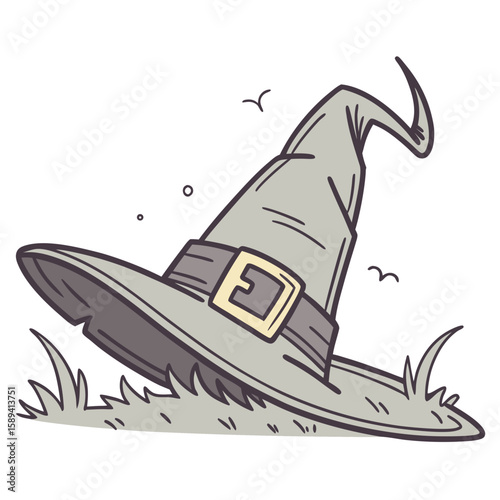 Witch hat lying on grass with a whimsical design  