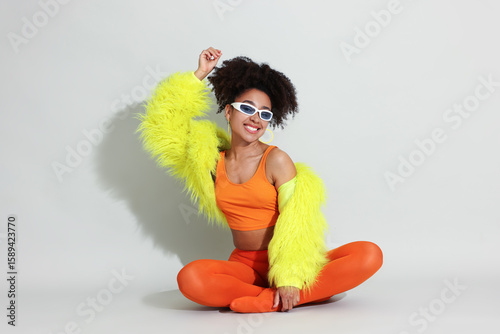 Photos Fashionable portrait of beautiful Brazilian woman in stylish outfit on white bac