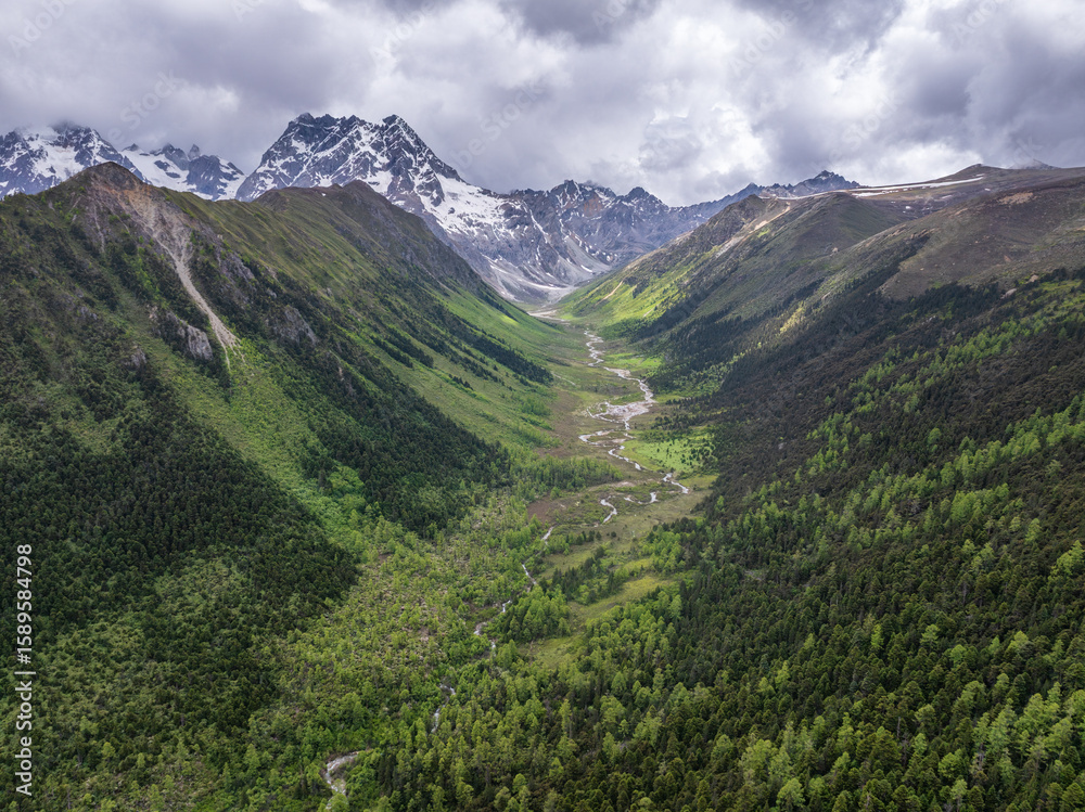 Fototapeta premium Beautiful aerial view of U-shaped valley landscape in Baima Snow Mountain