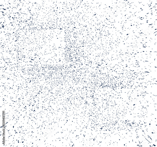 Dark blue speckles and streaks scattered on a white background abstract texture
