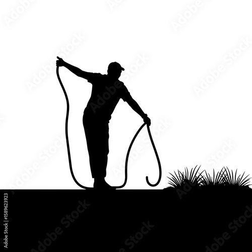 Gardener silhouette stretching hose while preparing for planting  