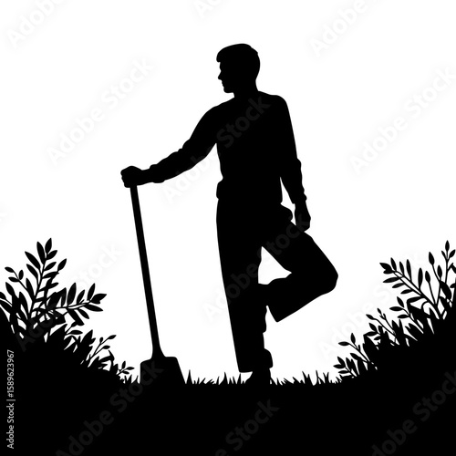 Silhouette of a man standing with a shovel in garden setting  