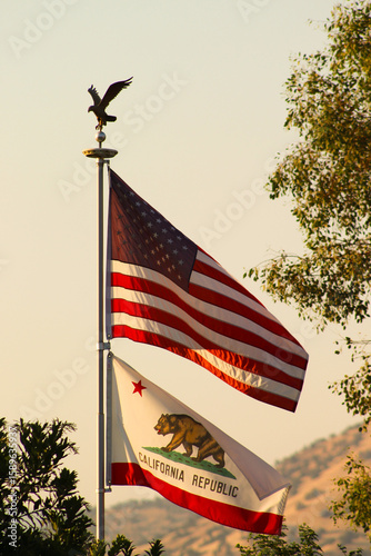 American flag and California flag in the evening sun
