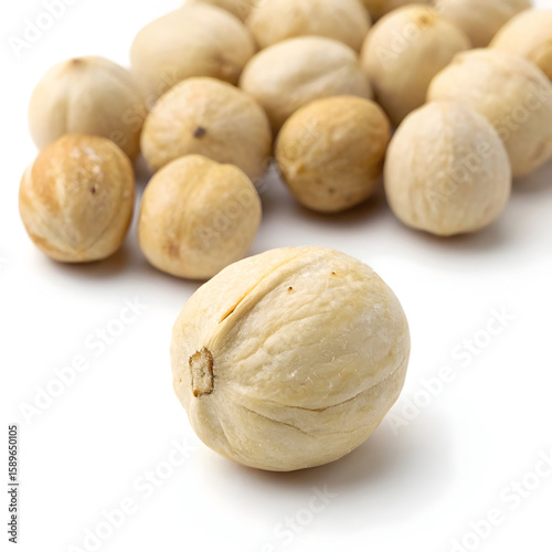 A single whole dried lotus seed, nutritious and mildly sweet, used in cooking,