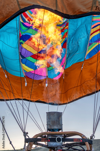 A hot air balloon with a fire in the middle of it