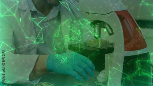 Scientist placing slide under microscope then adjusting knob, animating network globe for science