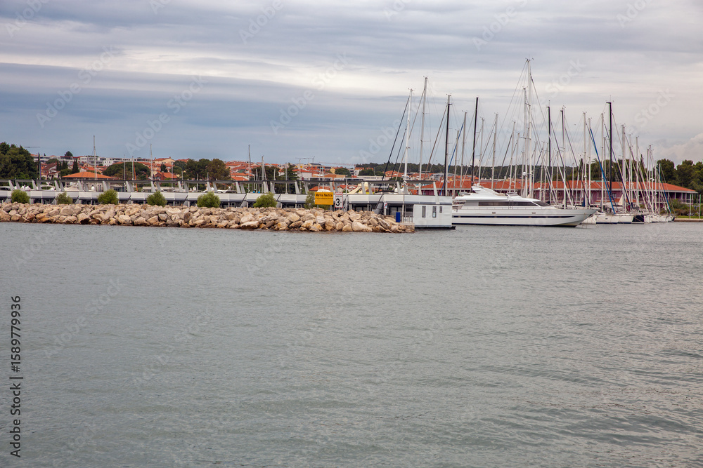 Fototapeta premium Marina with sailboats and yachts in Novigrad harbor, Croatia.
