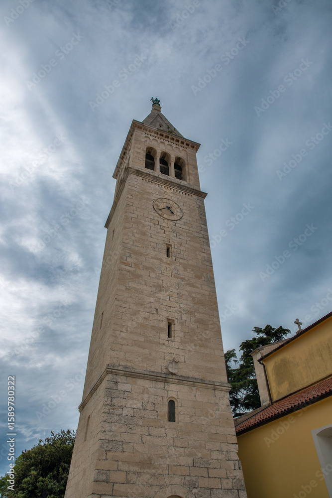 Obraz premium Stone bell tower with clock in Novigrad, Croatia.