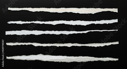 Torn Paper Strips on Black Background – Realistic Ripped Paper Edges Collection.