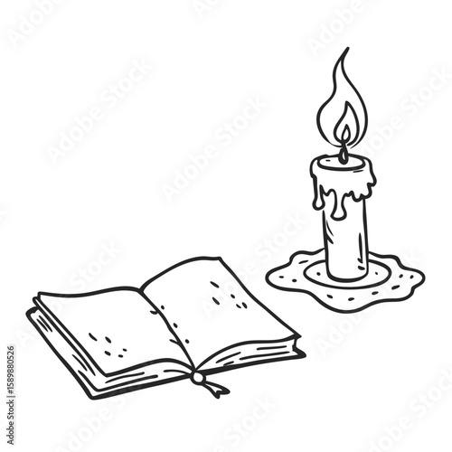 Open sketchbook beside candle with melting wax on table  