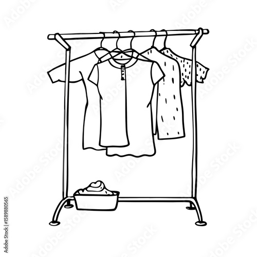 Clothing on a rack with laundry basket in a minimalist style  